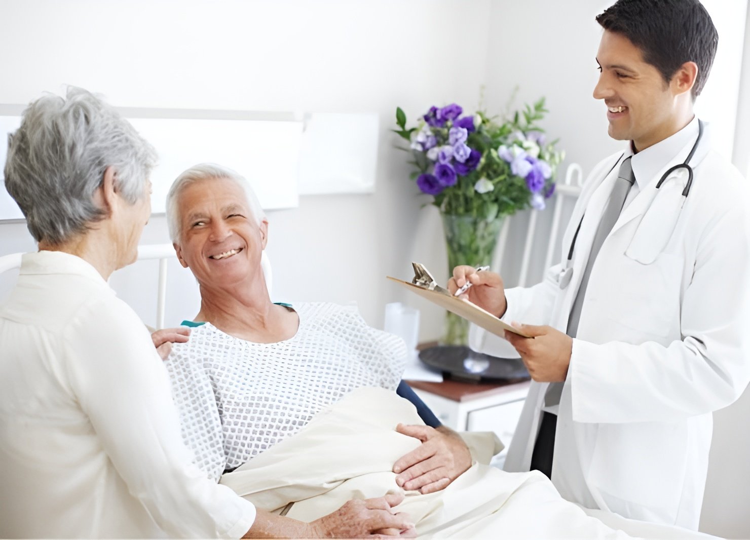 An elderly couple receiving positive news from a doctor, highlighting the importance of including healthcare directives in a parents' estate plan