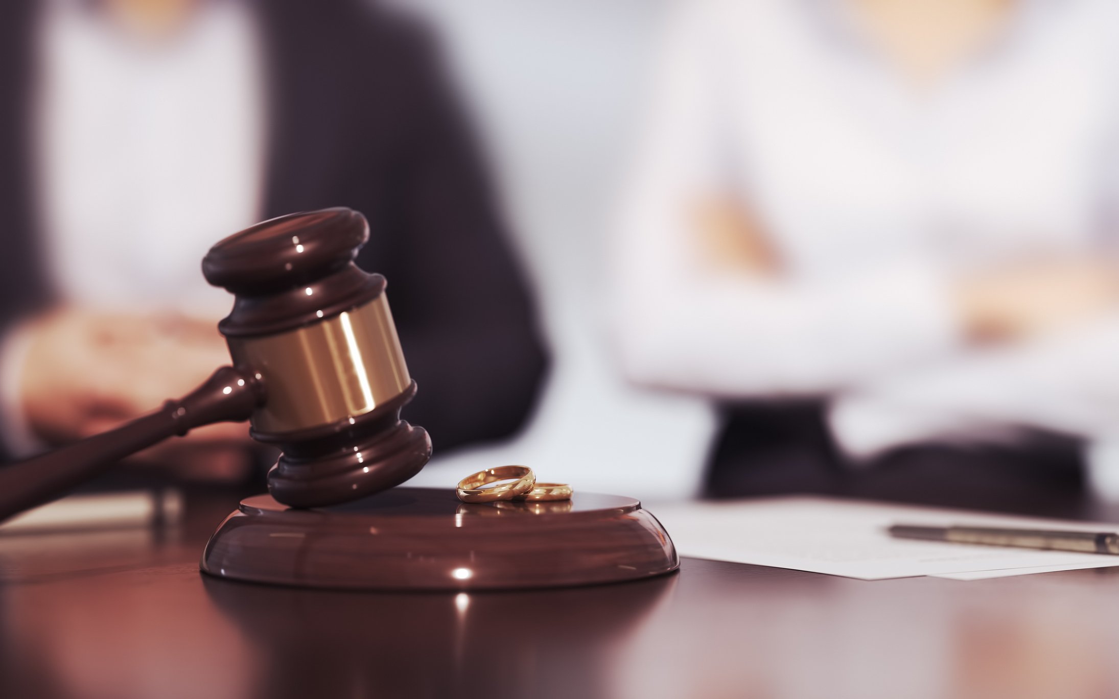3d Render Husband and Wife Judge's Gavel and Wedding Rings with Contested and Consensual Divorce Text, The Concept of Contested and Consensual Divorce (Depth Of Field)
