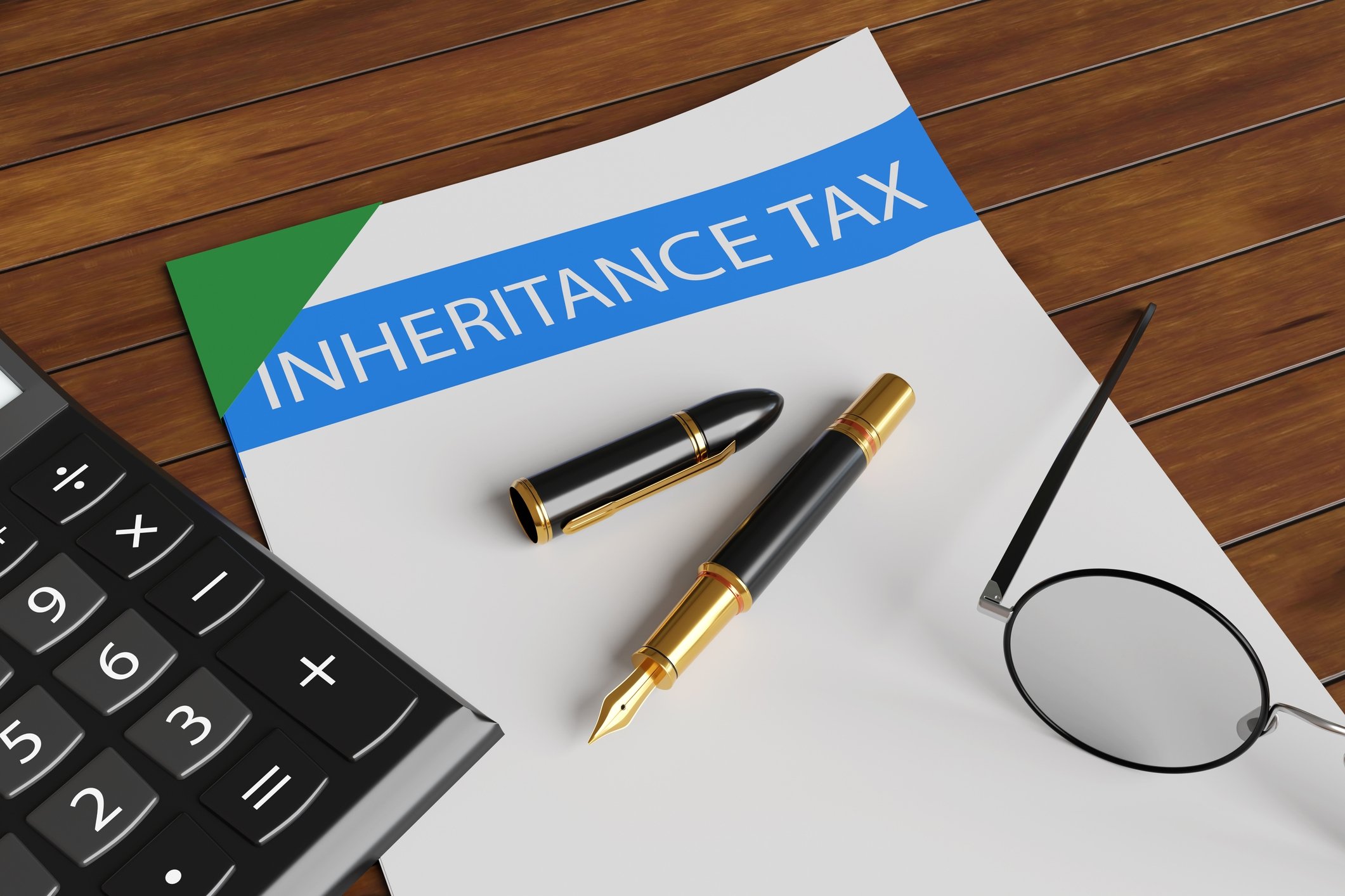 A document labeled "Inheritance Tax" lies on a wooden desk, accompanied by a pen, round glasses, and part of a calculator. The scene suggests financial planning.