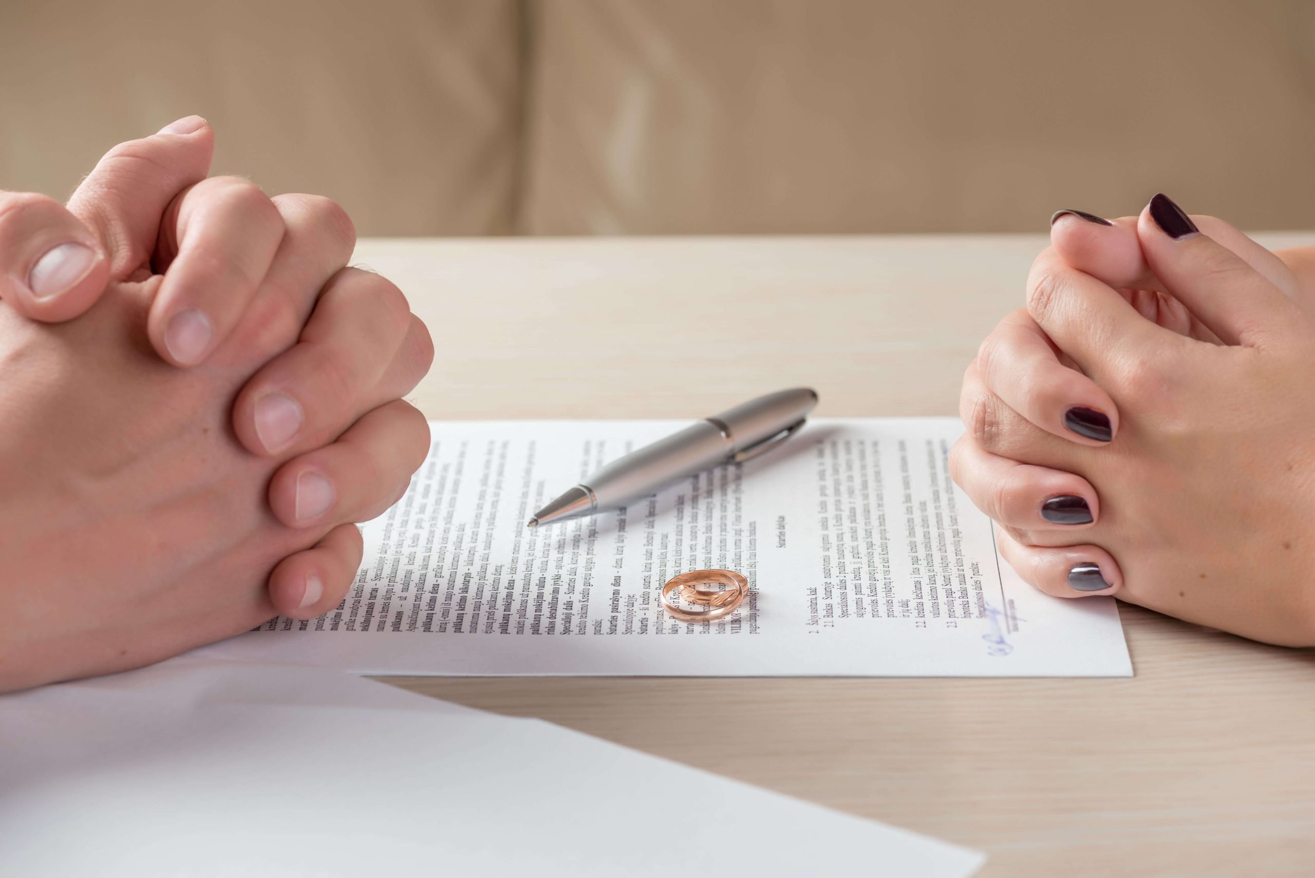 Wife and Husband Signing Premarital Agreement